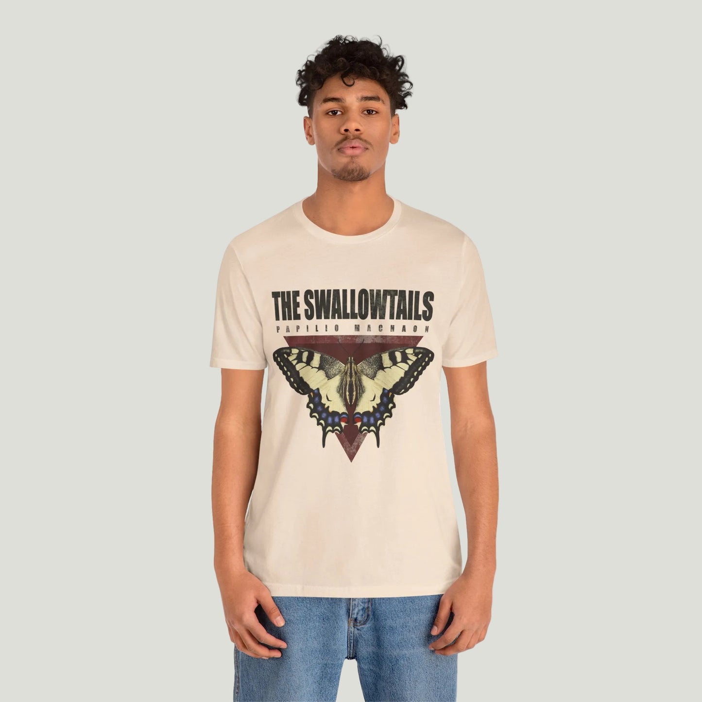 Person wearing a butterfly tee shirt with a graphic design on a white background
