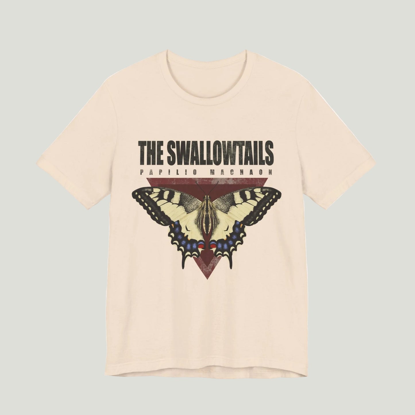 Beige t-shirt with butterfly graphic and text 'The Swallowtails' on a white background